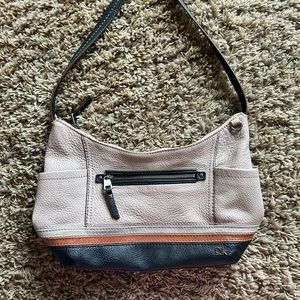 The Sak Kendra Hobo style purse. Dark brown strap, mauve colored body.